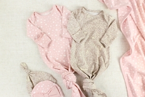pink and beige baby clothes