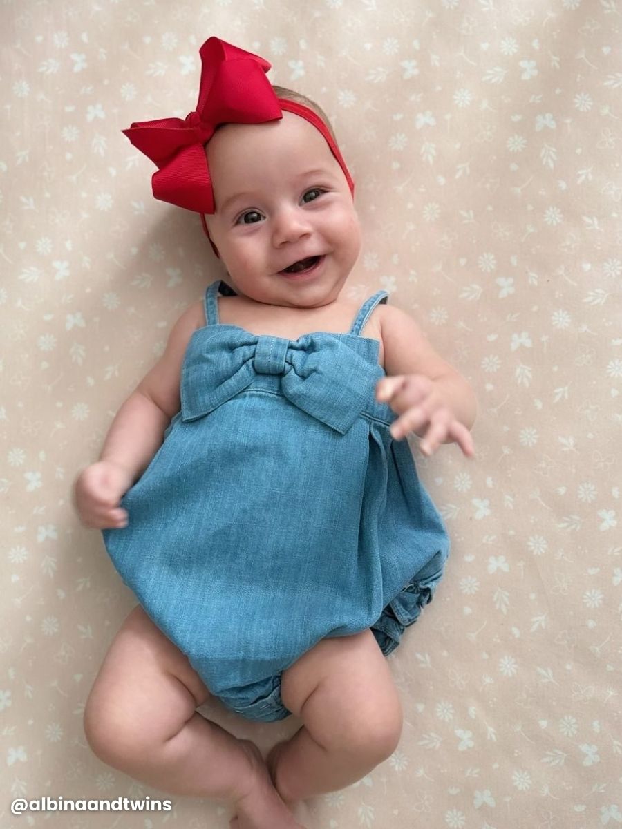 Light Wash Denim Bow Front Bubble Woven Romper