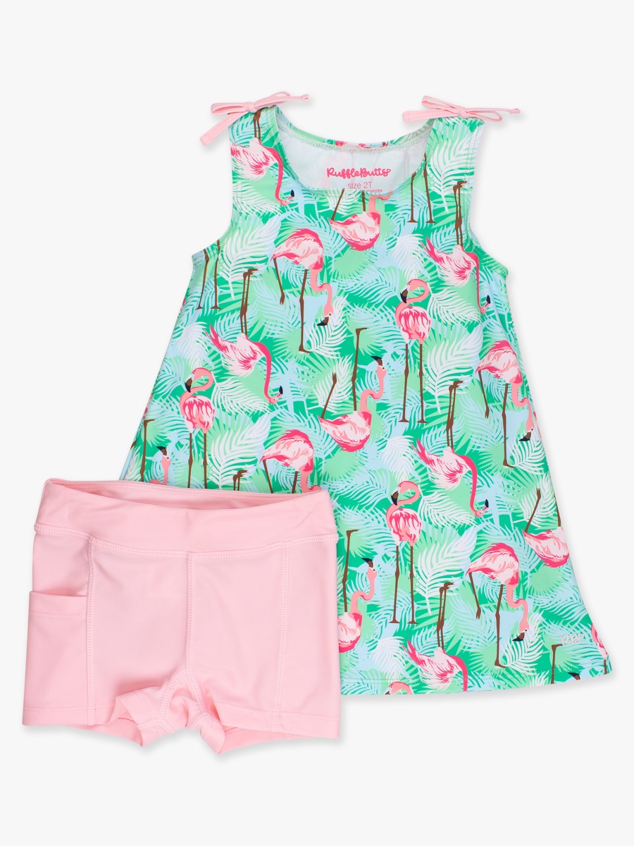 Line drawing of Green Vibrant Flamingo Active A-Line Bow Dress & Bike Short Set. A dotted circle indicates the approximate location for personalization.
