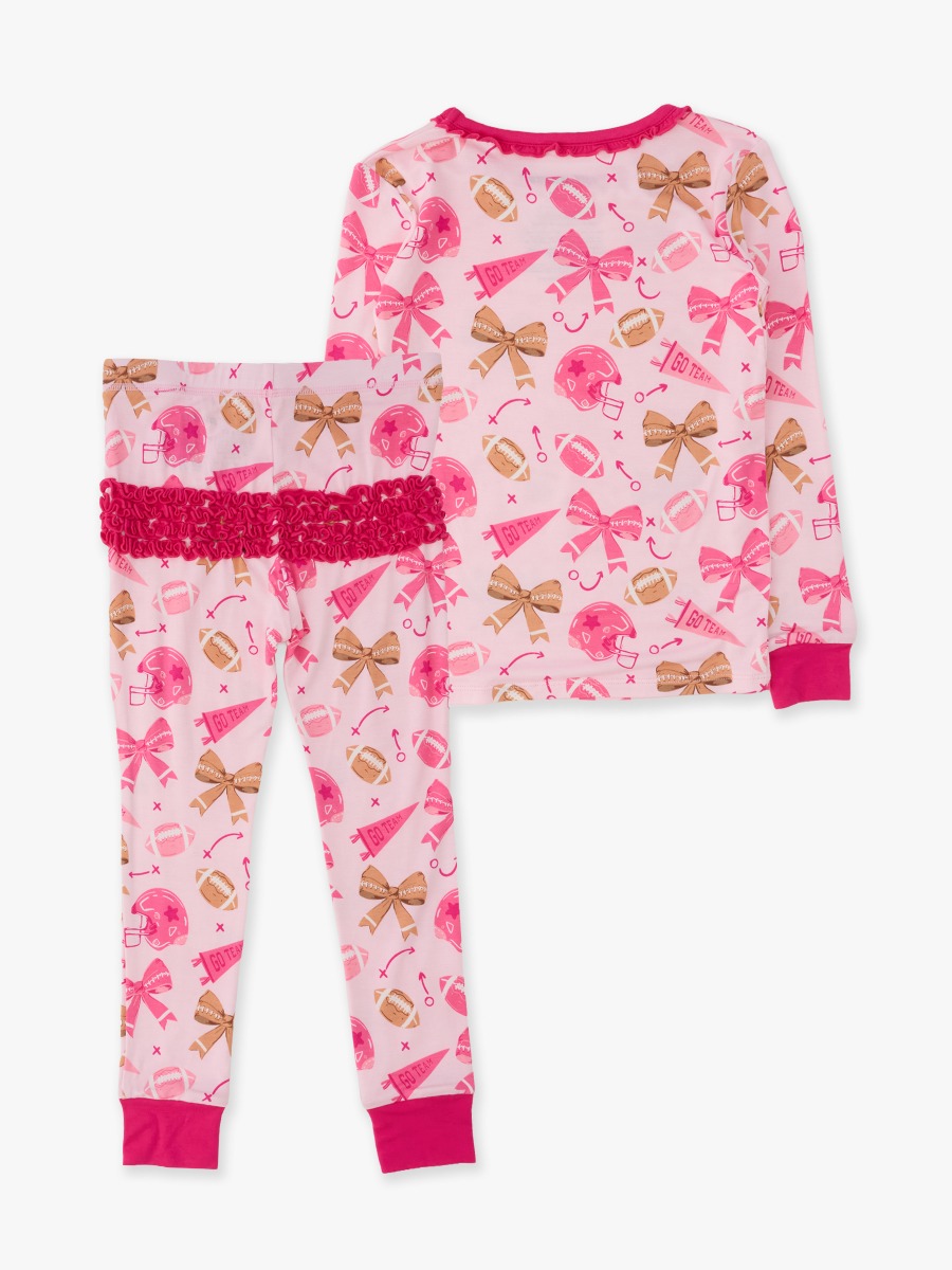 Line drawing of Footballs & Bows Toddler Ruffle Long Sleeve Pajama Set, Bamboo Viscose. A dotted circle indicates the approximate location for personalization.