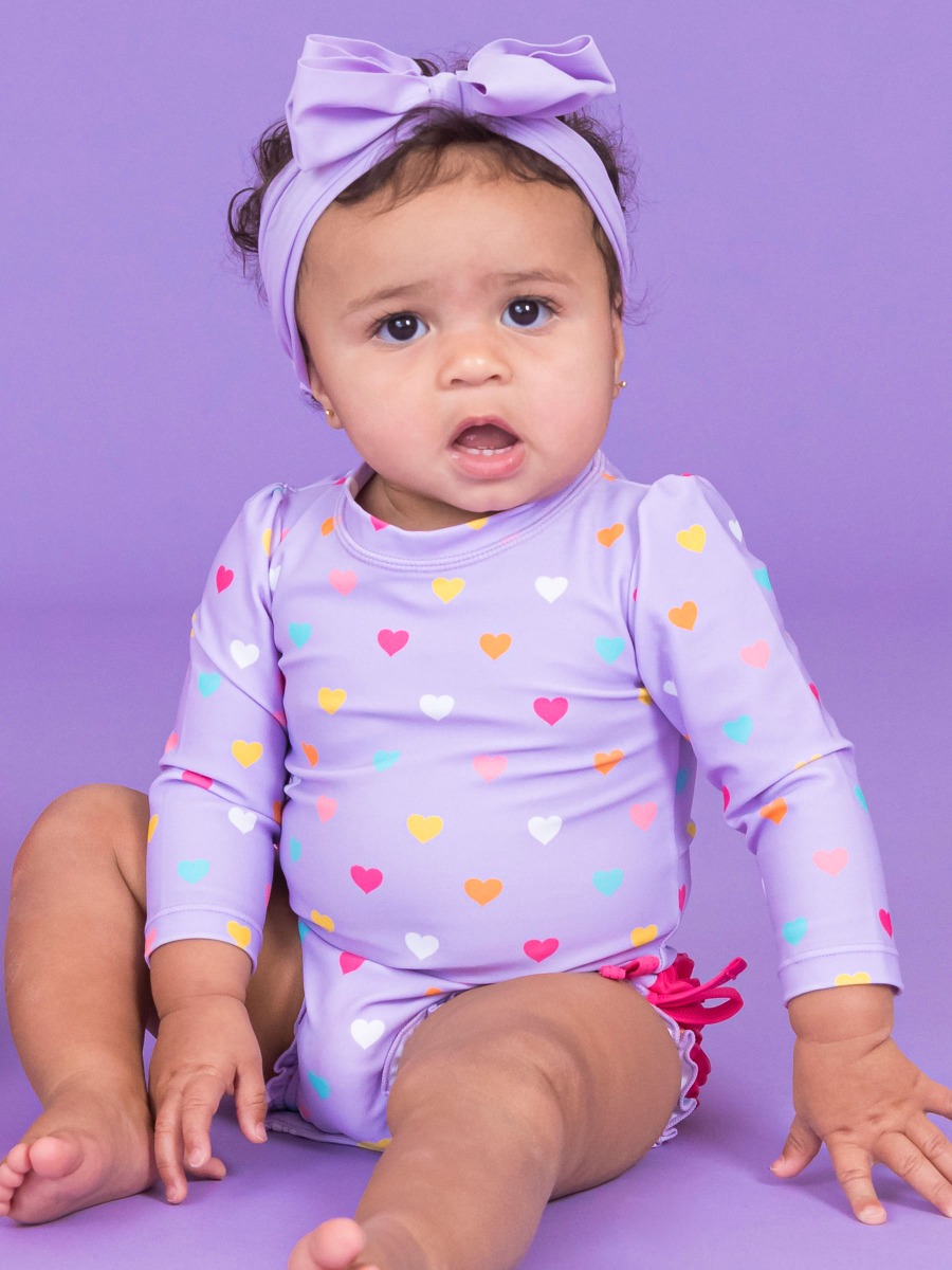 Lavender Colorful Hearts Long Sleeve One Piece Rash Guard Swimsuit, with Signature Rear Ruffles