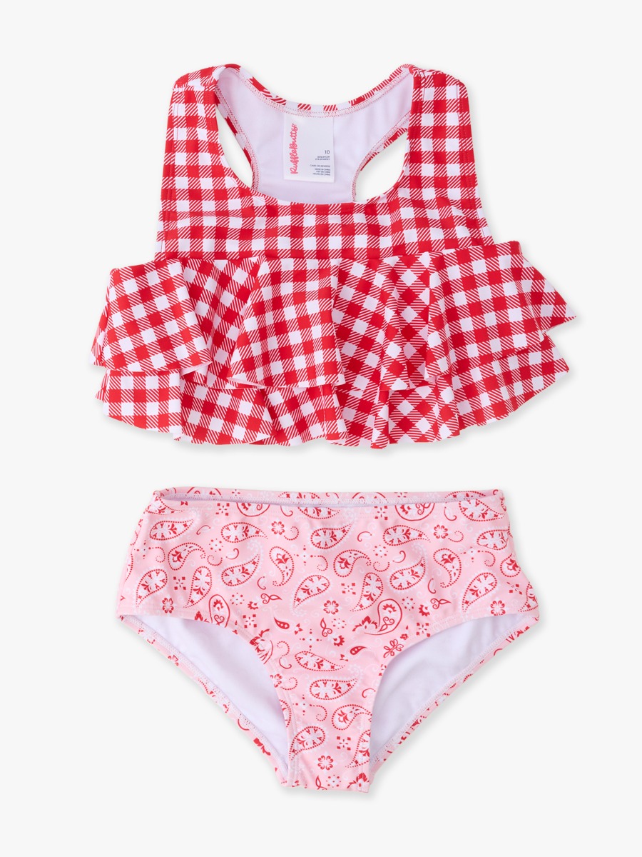 Line drawing of a swimsuit. A dotted circle is placed on the front center of the swimsuit's chest area, indicating the approximate location for personalization.