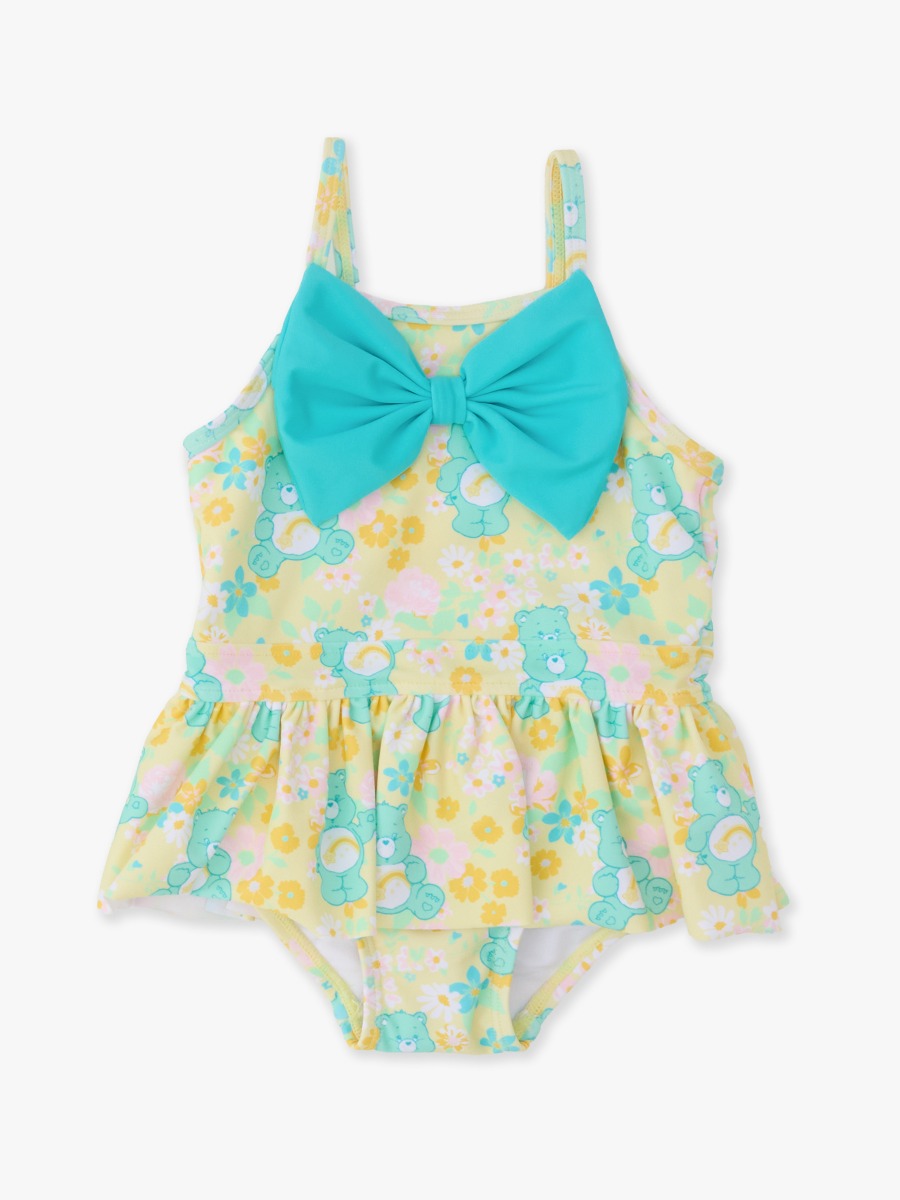 Line drawing of Banana Floral Care Bears Big Bow Skirted One Piece Swimsuit. A dotted circle indicates the approximate location for personalization.