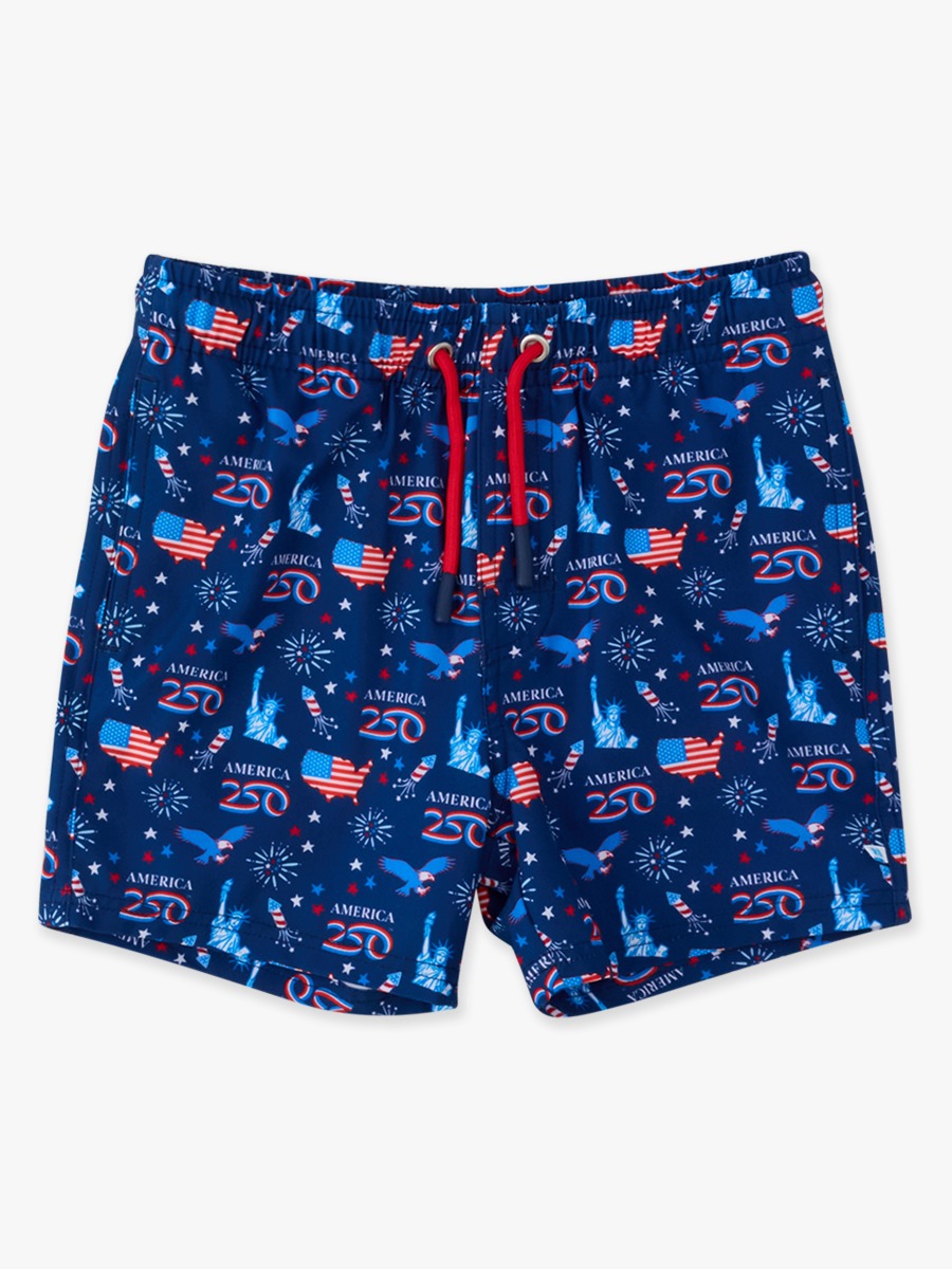 Line drawing of America250® Performance Hybrid Swim Trunks. A dotted circle indicates the approximate location for personalization.