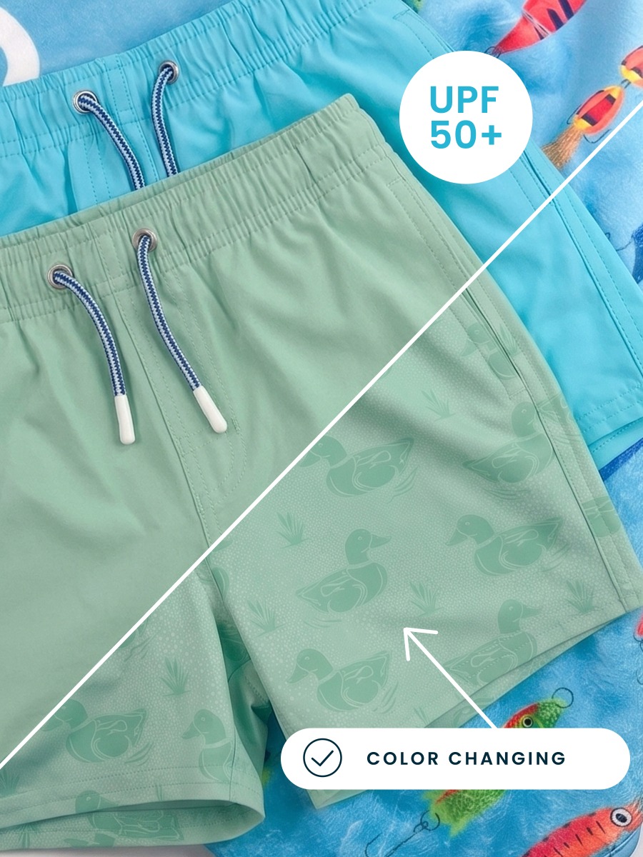 Line drawing of Sage Mallards Color Changing Performance Hybrid Swim Trunks. A dotted circle indicates the approximate location for personalization.
