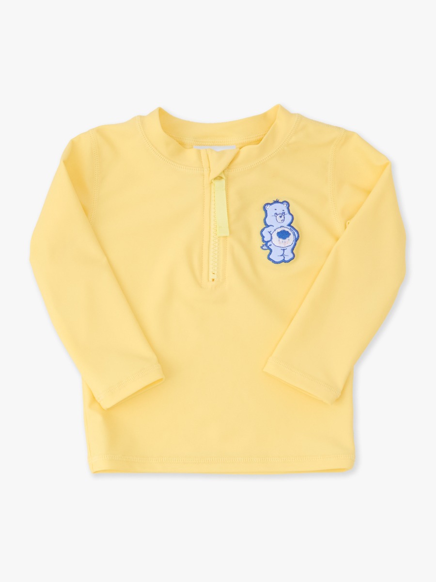 Line drawing of Grumpy Bear Care Bears Applique Long Sleeve Zipper Rash Guard. A dotted circle indicates the approximate location for personalization.