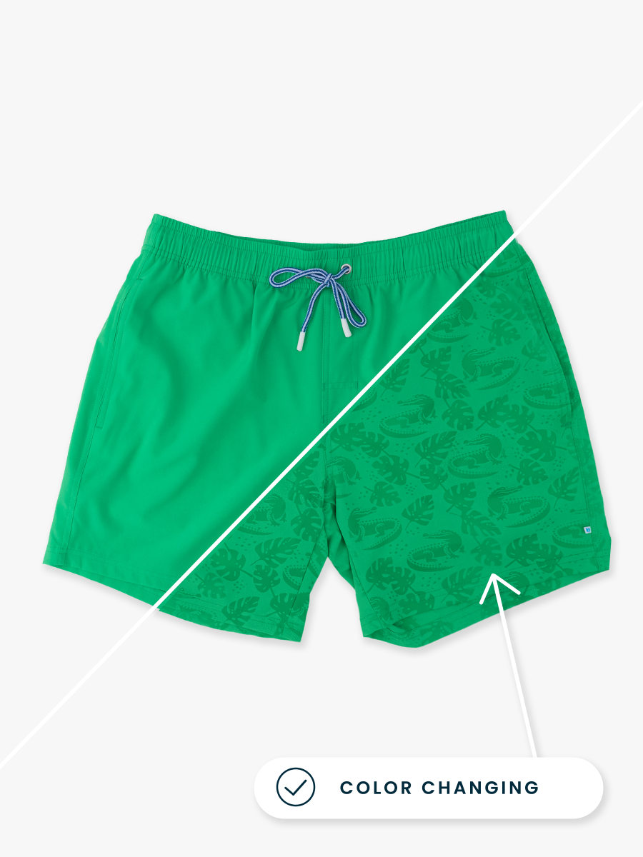 Line drawing of Bright Green Gators Color Changing Men's Performance Hybrid Swim Trunks. A dotted circle indicates the approximate location for personalization.