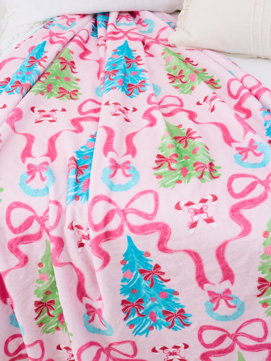 Line drawing of Merry & Bright Bows Printed Plush Minky Blanket. A dotted circle indicates the approximate location for personalization.