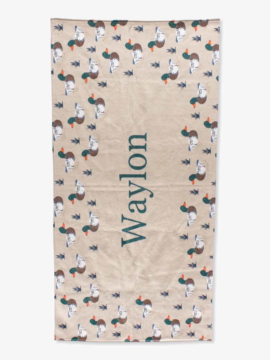 Line drawing of Mallard Marsh Personalized Beach Towel. A dotted circle indicates the approximate location for personalization.
