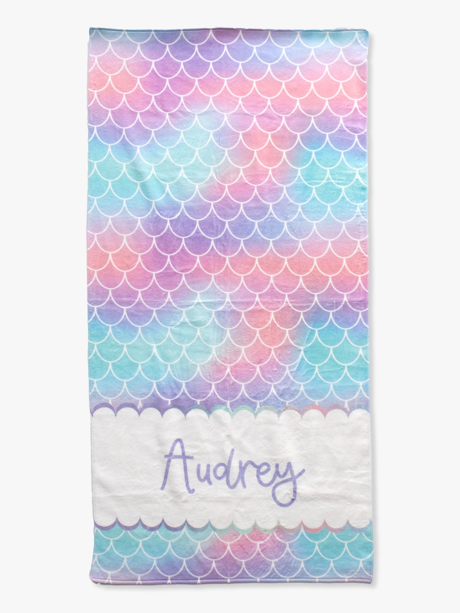 Line drawing of Mermaid Tale Personalized Beach Towel. A dotted circle indicates the approximate location for personalization.