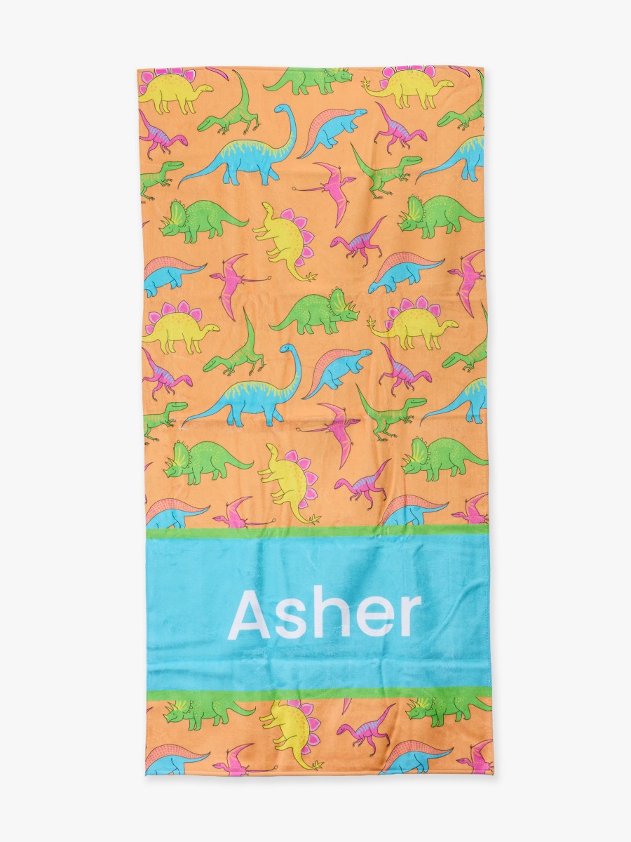 Line drawing of Neon Dino Personalized Beach Towel. A dotted circle indicates the approximate location for personalization.