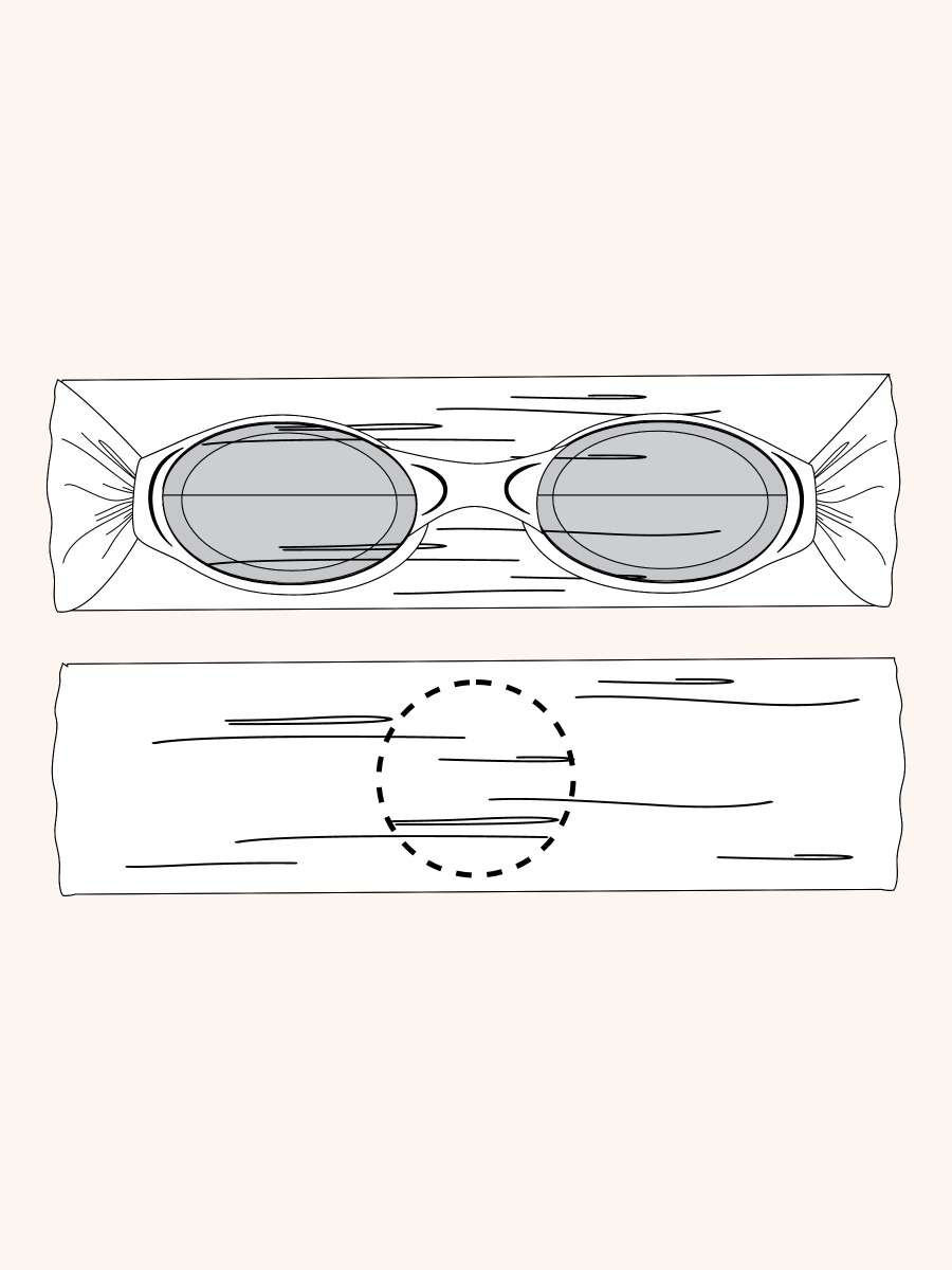 Line drawing of Pink Patriotic Gingham Swim Goggles. A dotted circle indicates the approximate location for personalization.