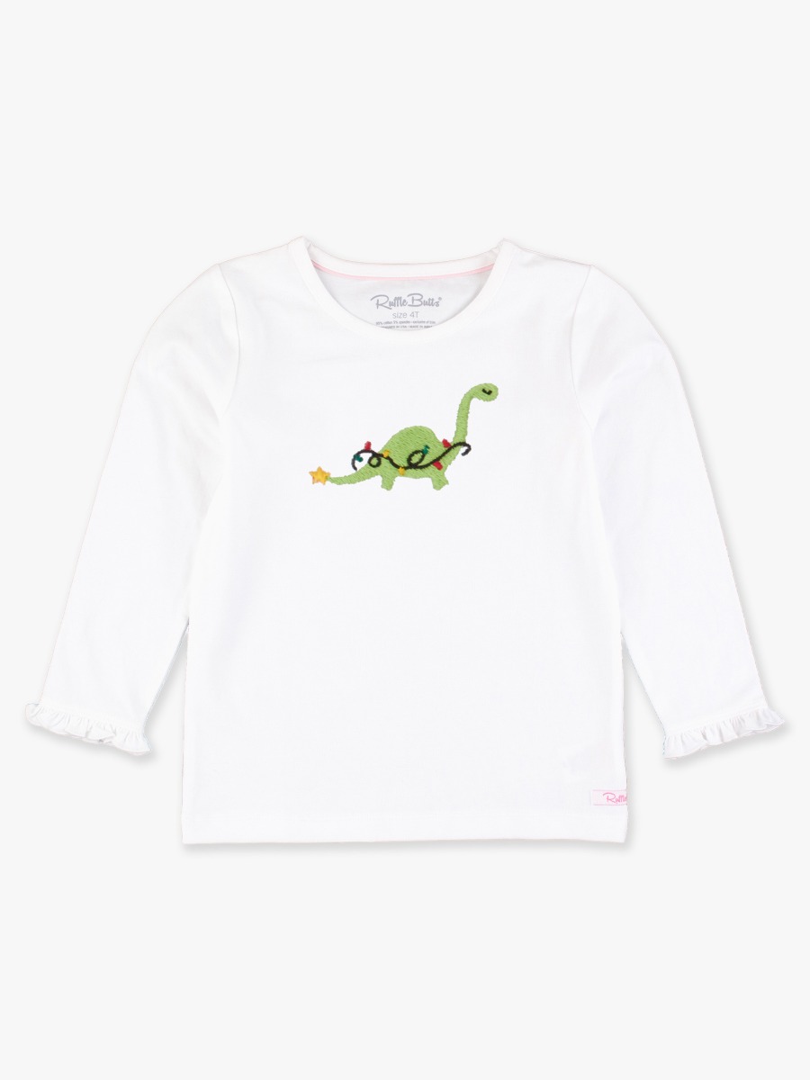 Line drawing of Holiday Dino Embroidered White Knit Long Sleeve Ruffle Layering Tee. A dotted circle indicates the approximate location for personalization.