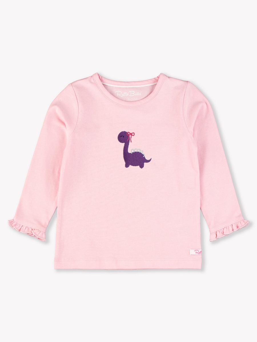 Line drawing of Purple Dino Embroidered Pink Knit Long Sleeve Ruffle Layering Tee. A dotted circle indicates the approximate location for personalization.