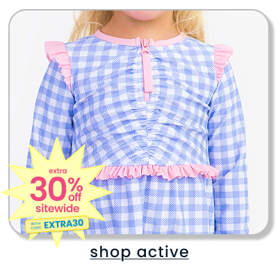 Blue gingham active top with pink ruffle trim and quarter-zip neckline. Promotional badge reads ‘Extra 30% off sitewide with code EXTRA30.’ Text below reads ‘shop active.’