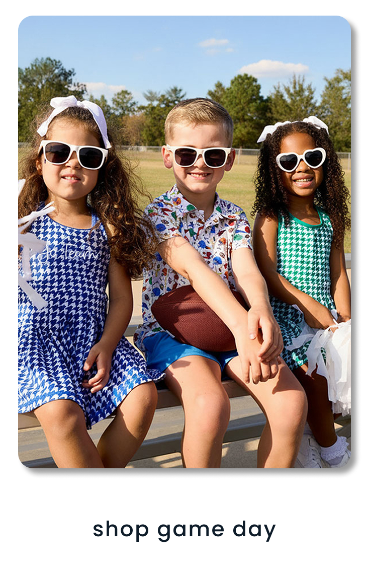 "Banner reading ‘Shop Game Day’ with football-themed graphics. Three children wearing coordinated game day outfits sit on bleachers. Includes a green ‘Shop New’ button."