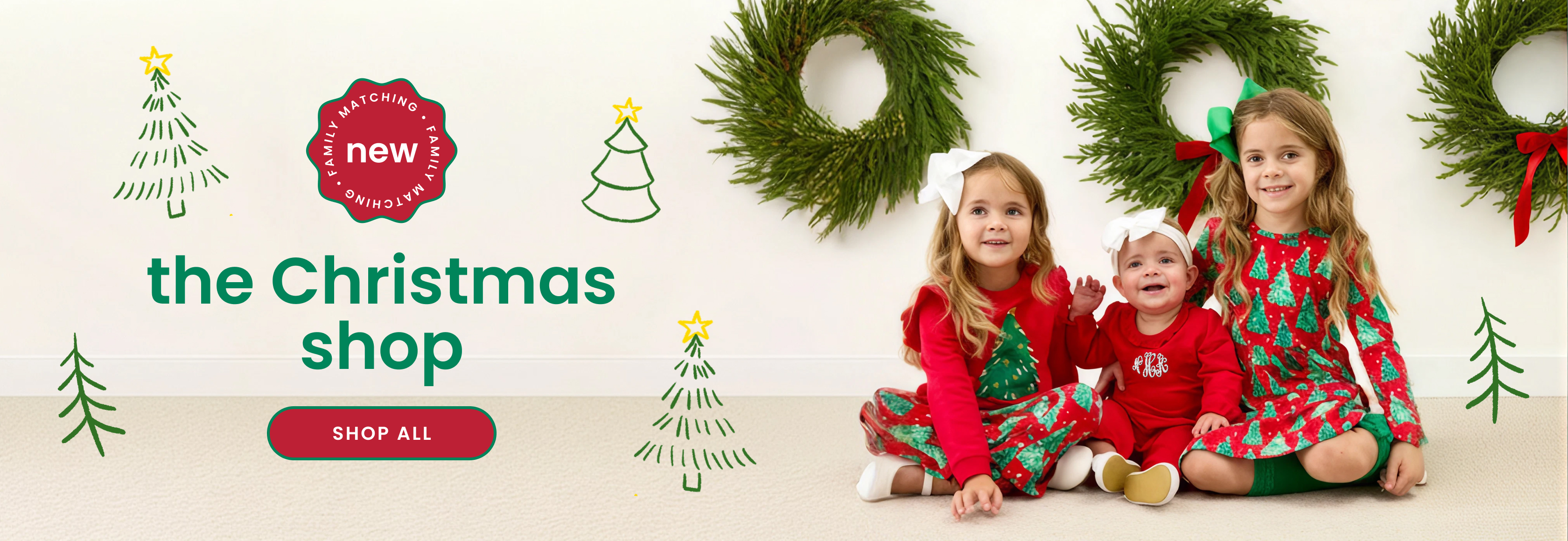 Promotional banner showing four people wearing matching pink Christmas pajamas. Text reads ‘The Christmas Shop,’ featuring new prints, fresh styles, and matching looks for the whole family, with a Shop All button.