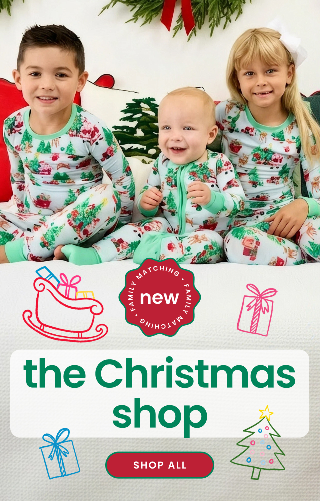 "Holiday banner reading ‘The Christmas Shop’ with a family matching badge and ‘Shop All’ button. Features coordinating Christmas pajamas with Santa, tree, gift, and reindeer prints."