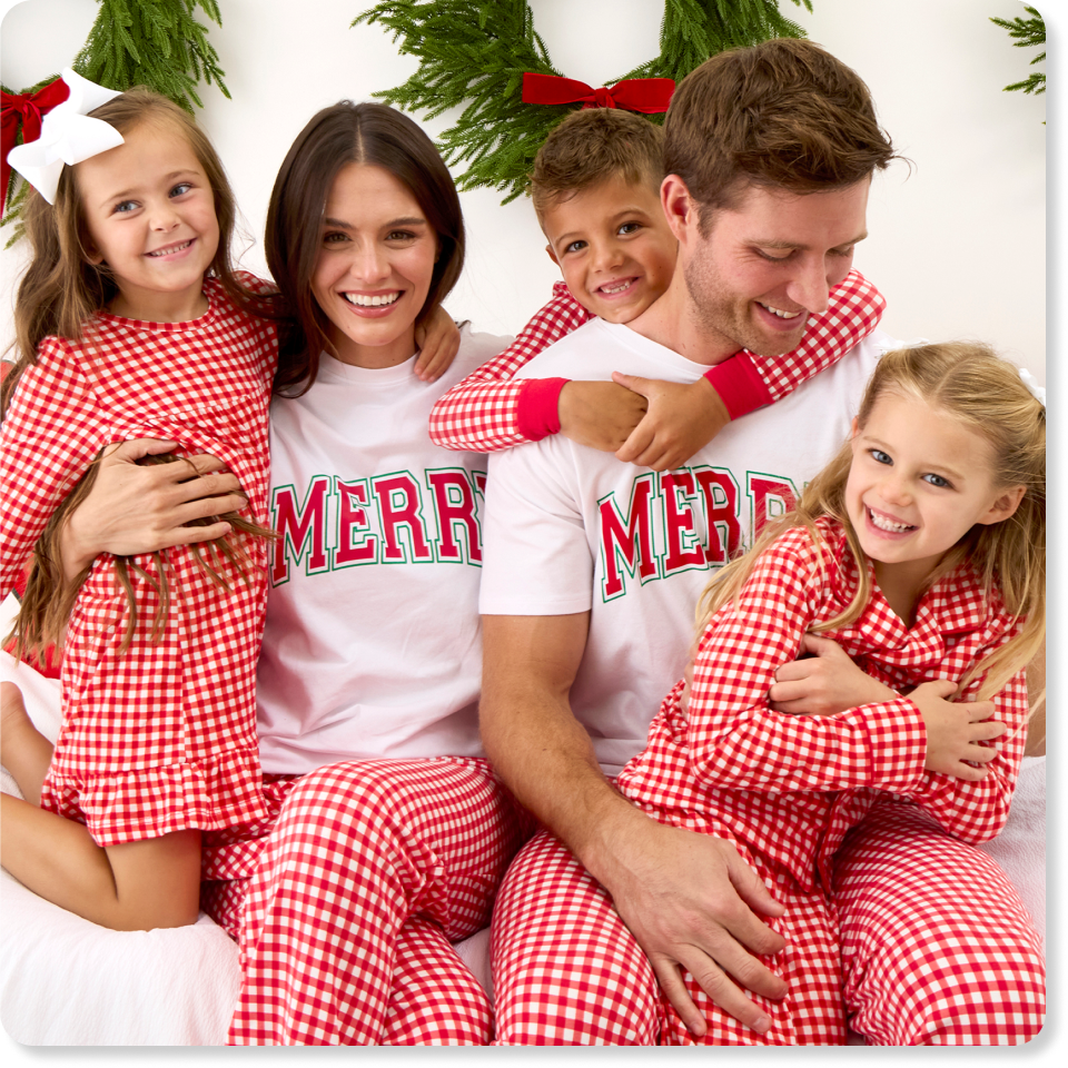 Promotional image showing four family members wearing matching red gingham holiday pajamas and coordinating tops. Featured as family matching sleepwear and loungewear.