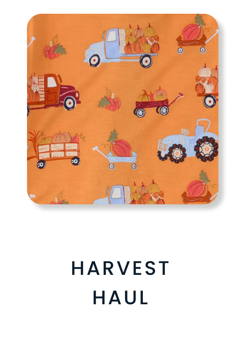 Shop By Print tile featuring an orange pattern with pumpkins, wagons, trucks, and tractors carrying harvest produce. Text reads ‘Harvest Haul.