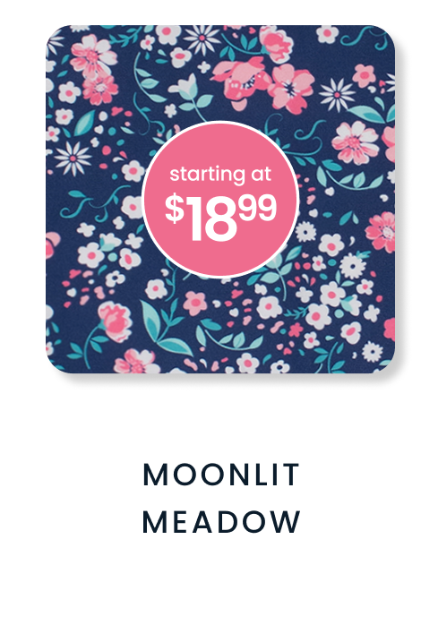 "Navy floral pattern with pink, white, and blue flowers and leafy accents. Price badge reads &lsquo;starting at $18.99.&rsquo; Text below reads &lsquo;Moonlit Meadow.&rsquo;"
