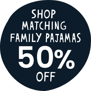 Dark blue circular graphic with white text that reads 'Shop Matching Family Pajamas 50% Off.' Links to family pajama collection.
