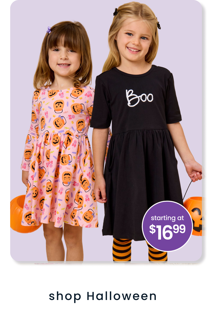 Promotional image showing two children holding pumpkin pails and wearing Halloween dresses. Text reads ‘shop Halloween’ and ‘starting at $16.99.