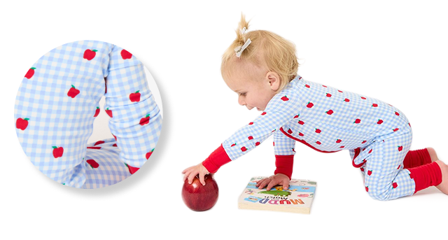 Promotional image showing a baby wearing a blue gingham sleeper with red apple print accents. Close-up inset highlights fabric detail and stretch.