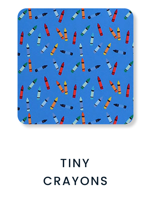 "Pattern featuring colorful crayons in red, blue, green, yellow, and black scattered across a bright blue background."