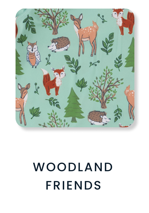 Shop By Print tile featuring a mint green woodland pattern with foxes, deer, owls, hedgehogs, trees, and leaves. Text reads ‘Woodland Friends.’