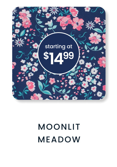 "Navy floral pattern with pink, white, and blue flowers and leafy accents. Price badge reads ‘starting at $14.99.’ Text below reads ‘Moonlit Meadow.’"