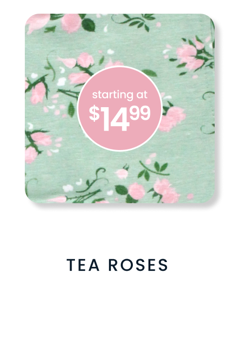 "Soft mint floral pattern with pink rose blossoms and green vines. Price badge reads ‘starting at $14.99.’ Text below reads ‘Tea Roses.’"