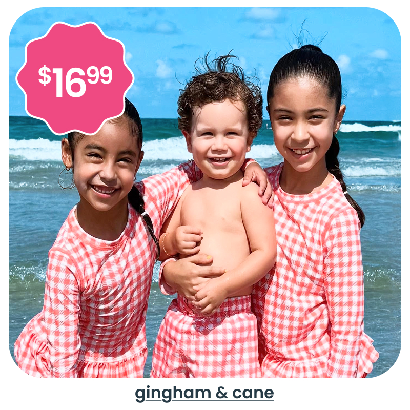 "Beach image showing three children wearing matching red gingham swimwear. A pink badge reads &lsquo;$16.99.&rsquo; Text below reads &lsquo;gingham & cane.&rsquo;"